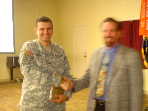 In September, Larry Singer (r), chapter president, thanks Col. John Rose for his presentation on Army intelligence.